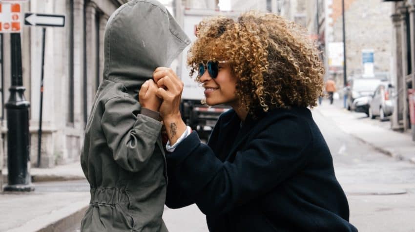 Mom smiling at son as she connects with her kid