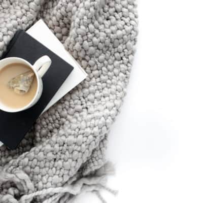 Cozy blanket and hot cup of tea