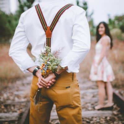 man holding flowers for wife