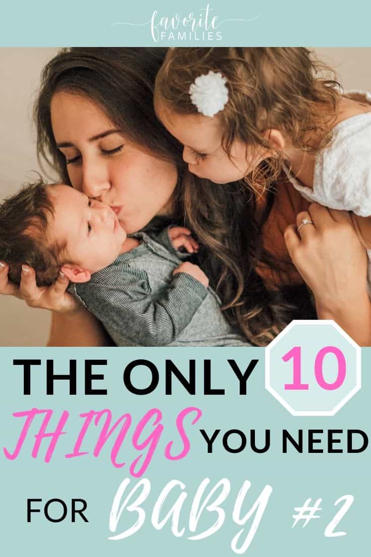 Mom kissing baby with text overlay the only 10 things you need for baby #2