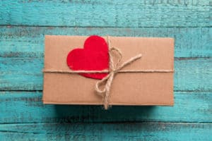 experience gift wrapped on a wooden background