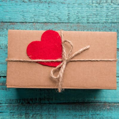 experience gift wrapped on a wooden background