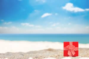 red gift box on the beach