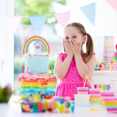 young girl excited about birthday cake